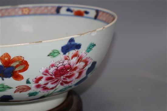 An 18th century Chinese verte Imari bowl on wood stand, c.1740, diameter 26cm